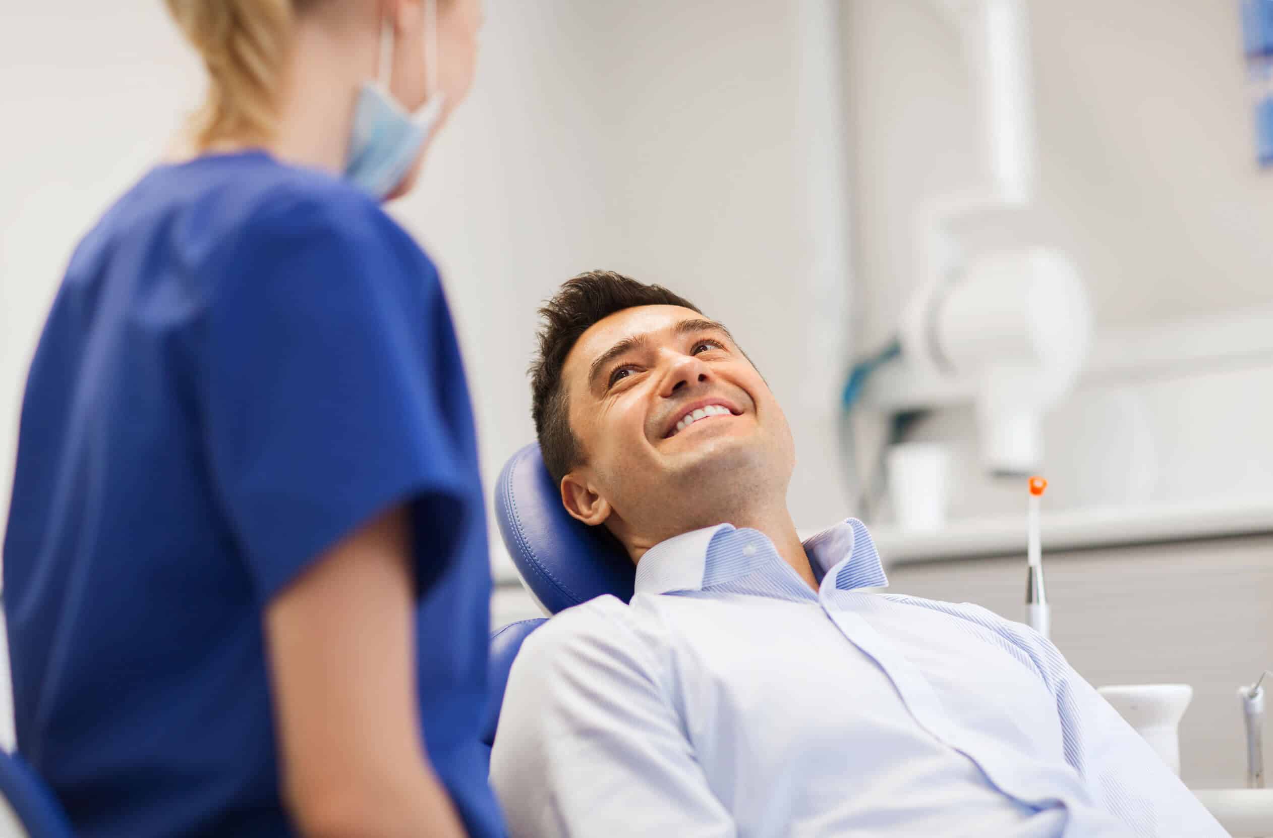 man smiling at hamilton dentist during checkup